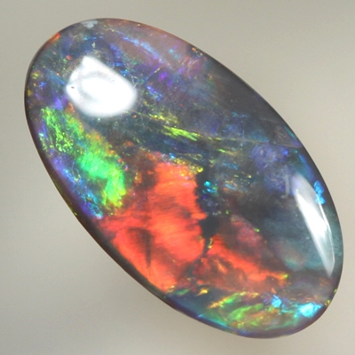 SOLID BLACK OPAL Bright reds over blues